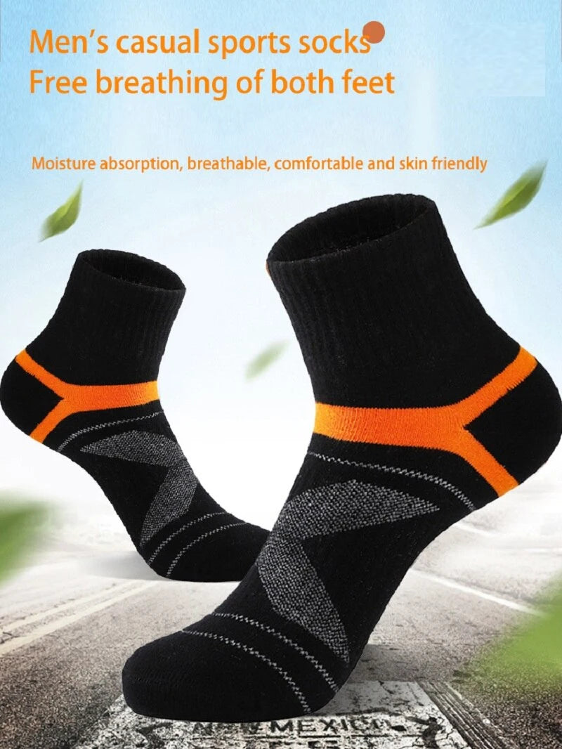 Black socks with orange accents on a blurred street background